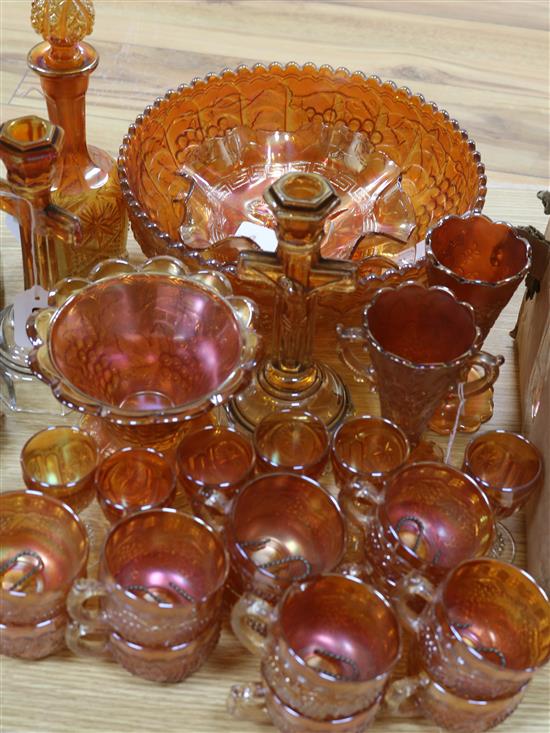 A pair of Carnival glass crucifix candlesticks and a collection of other marigold Carnival glass,